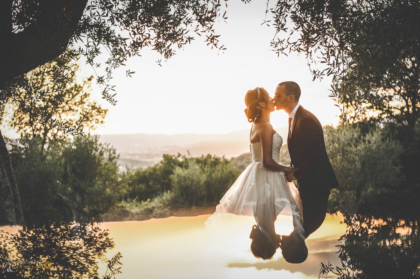 Romantic kiss at sunset.