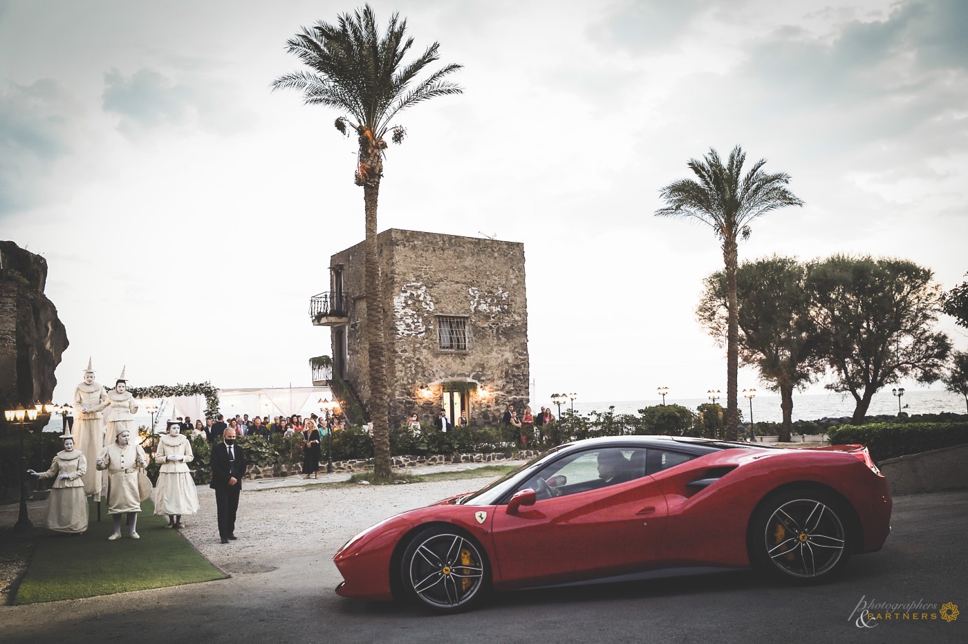 Errival at Torre Saracena of the Bride & Groom in Ferrari.