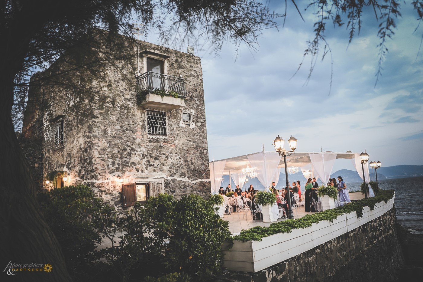 Guests on the splendid terrace overlooking the Gulf of Naples.