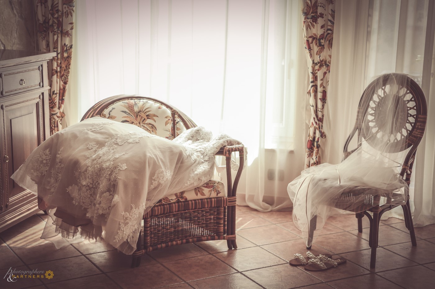 A beautiful, embroidered dress is gently waiting for the bride.